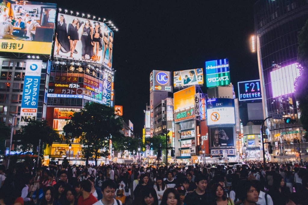 A crowded modern city at night